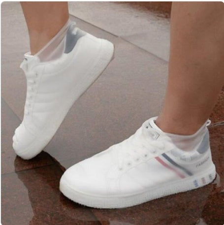 White rain boot shoe covers with elastic ankle opening and grippy sole, slip-on