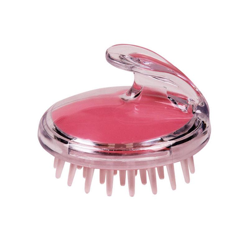 Silicone scalp massage brush with clear circular head, pink gel center, pink bristles