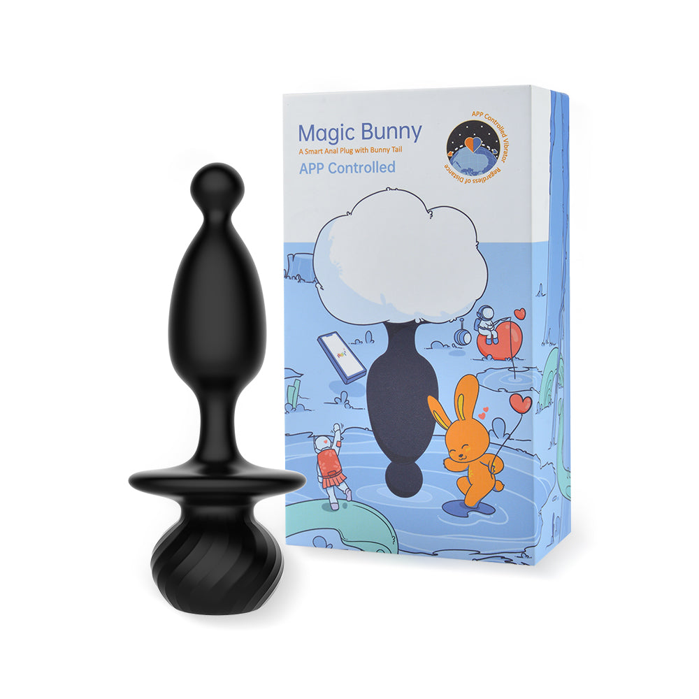 Black silicone bunny tail toy next to retail box packaging