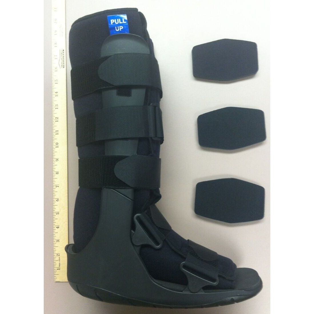 Black ankle walker boot with adjustable straps and pull-up tab