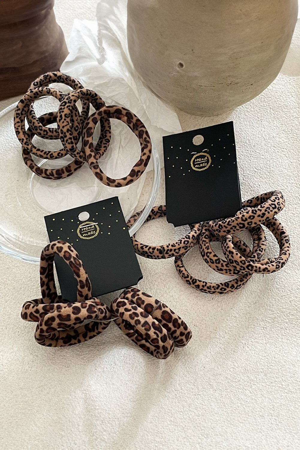 Leopard-print elastic hair tie set with multiple coffee-brown ties, black spots