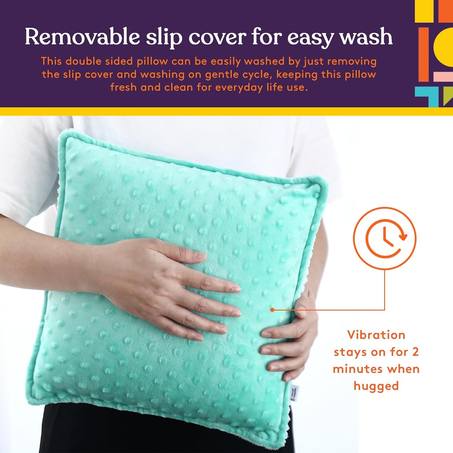 Teal sensory vibrating pillow with dot texture, hands holding the cover