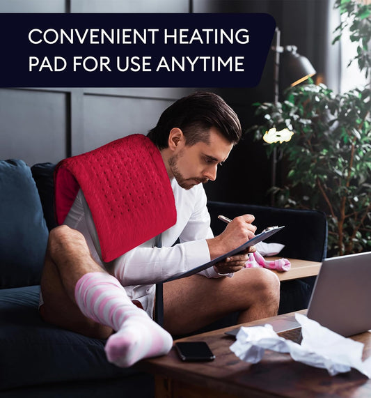 Viva magenta heating pad draped on a person’s back, plush dotted surface