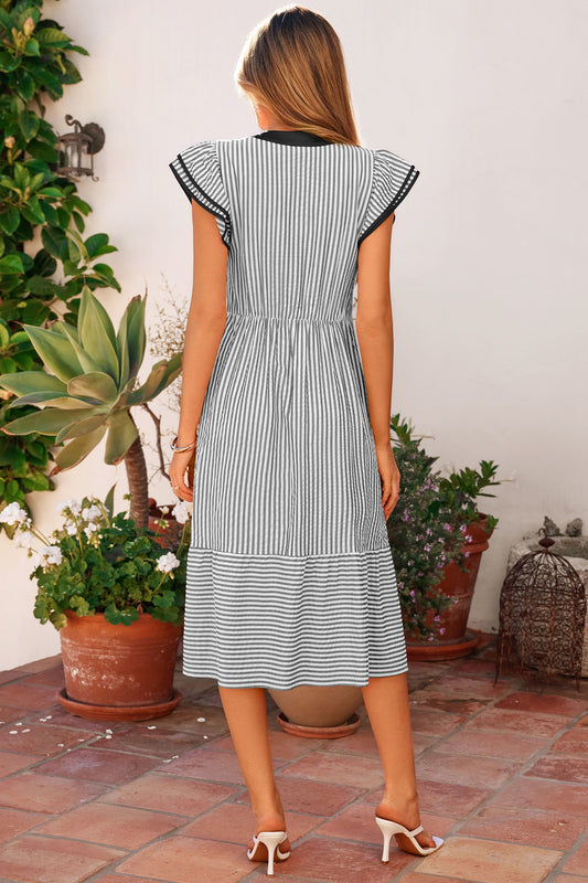 Back view long striped dress with short flutter sleeves and tiered skirt hem