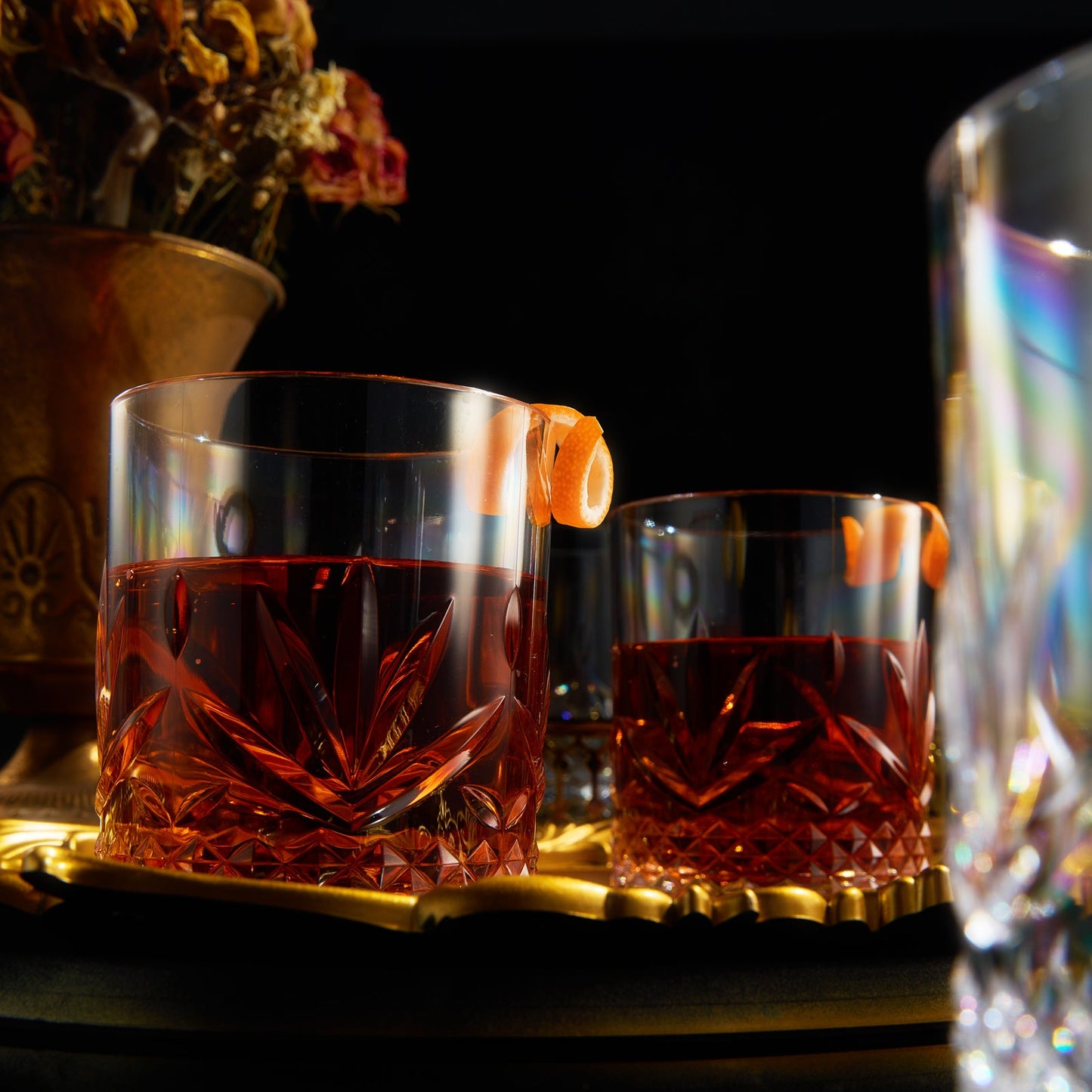 Amber acrylic crystal lowball glass with sharp cut facets and diamond base