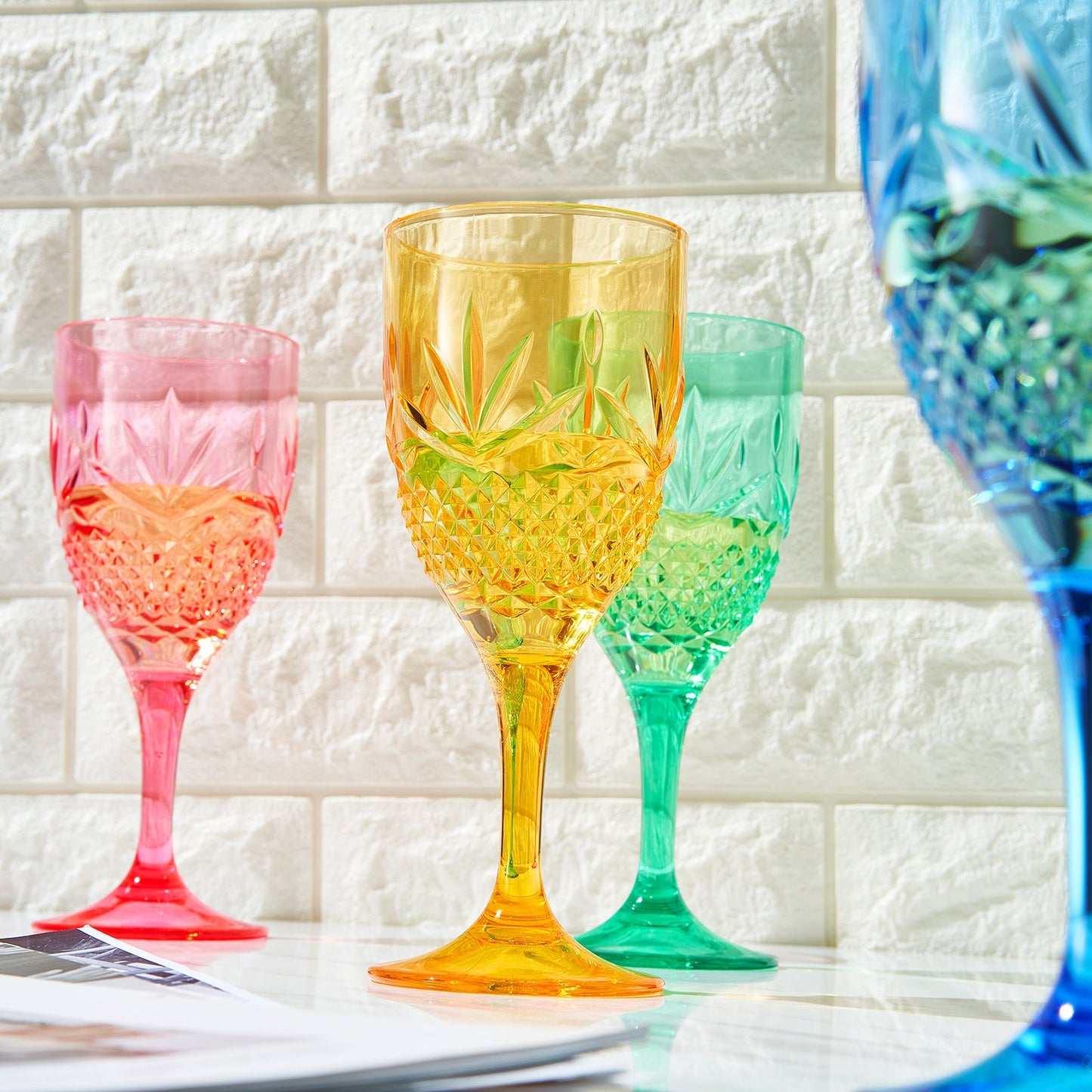Stemmed acrylic wine glasses with faceted cut; pink amber green blue (partial set of 4)