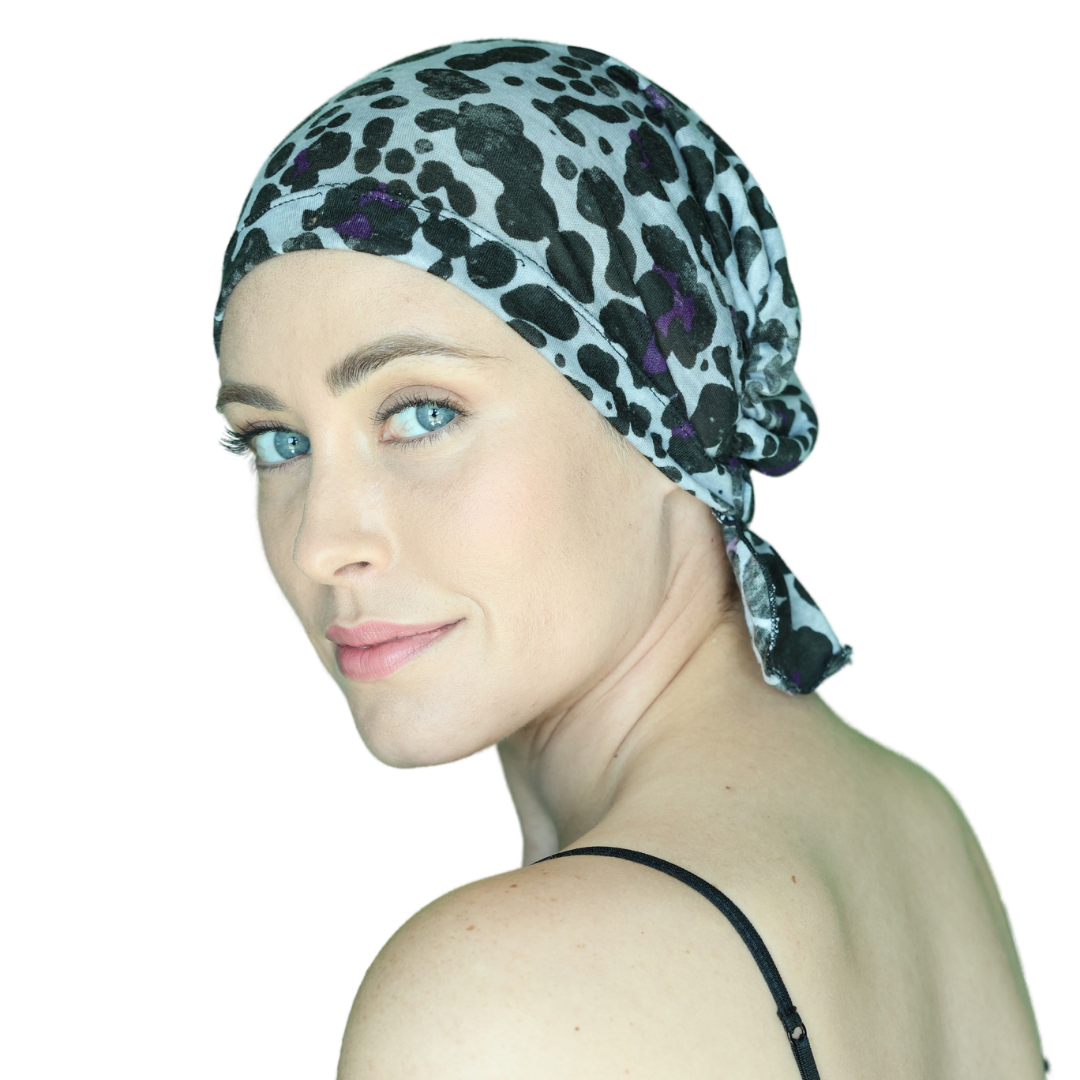 KATY CHEMOBEANIES® chemo beanie with leopard print in teal and purple, profile view