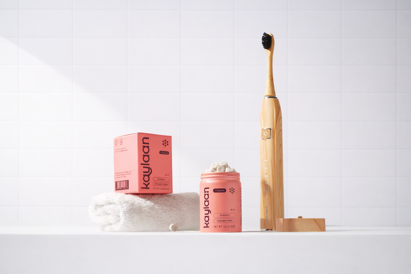 Bamboo electric toothbrush kit with wooden handle and black bristle head beside boxes