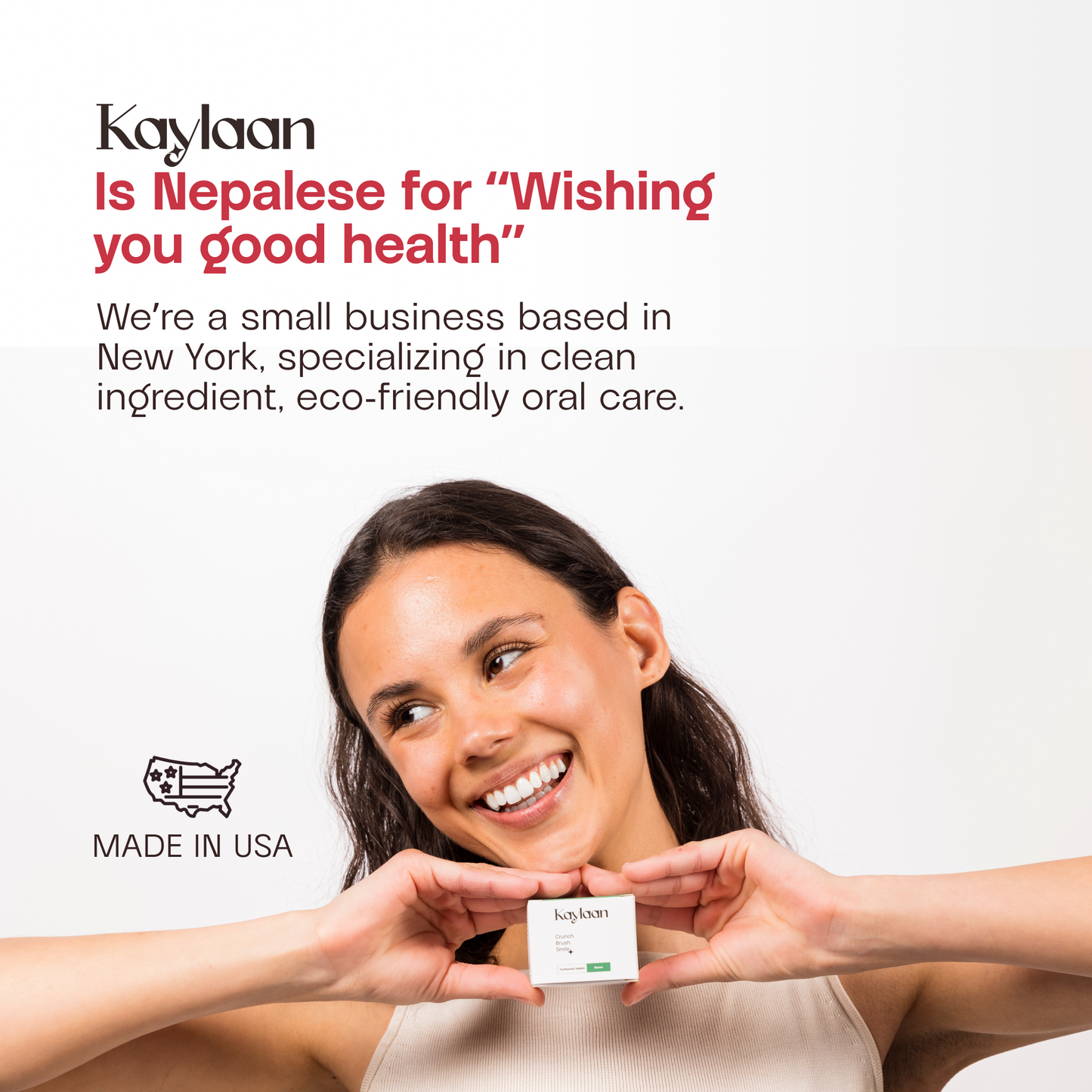 Non-fluoride strawberry toothpaste tablets jar held by smiling person, Kaylaan label