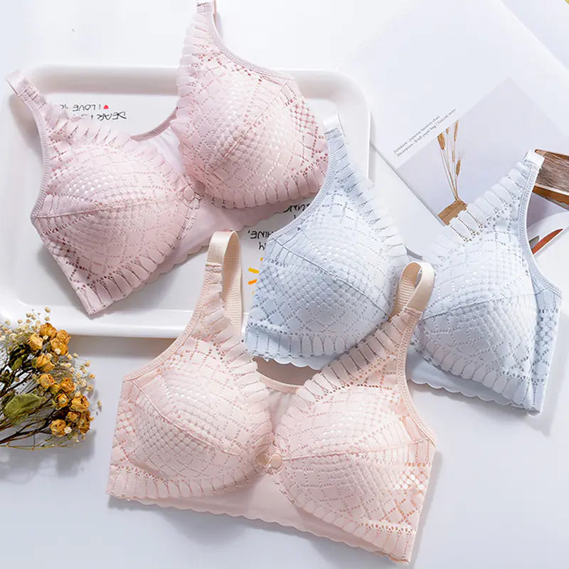 Set of maternity nursing bras in pink and light blue with scalloped lace cups