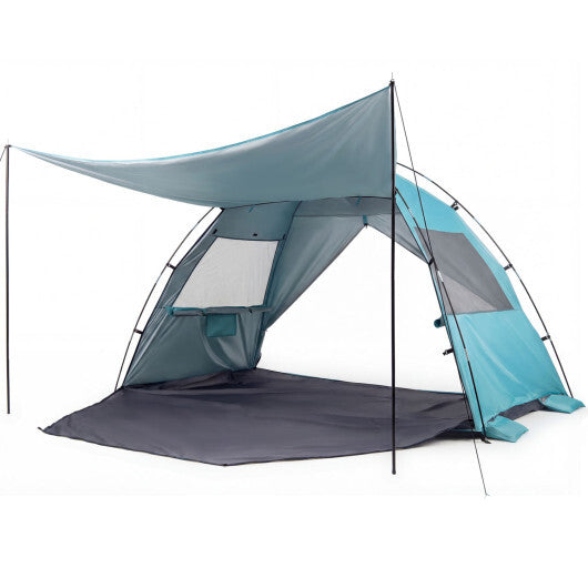 Pop-up beach sun shelter with canopy and mesh side walls, dark ground mat