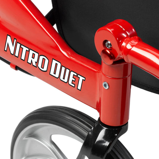 Red metal frame bar with black lettering and glossy hardware on a rollator chair