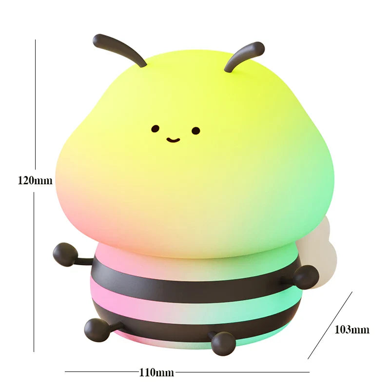 Bee-shaped night light size diagram with smiling face, rainbow glow, and three stacked rings