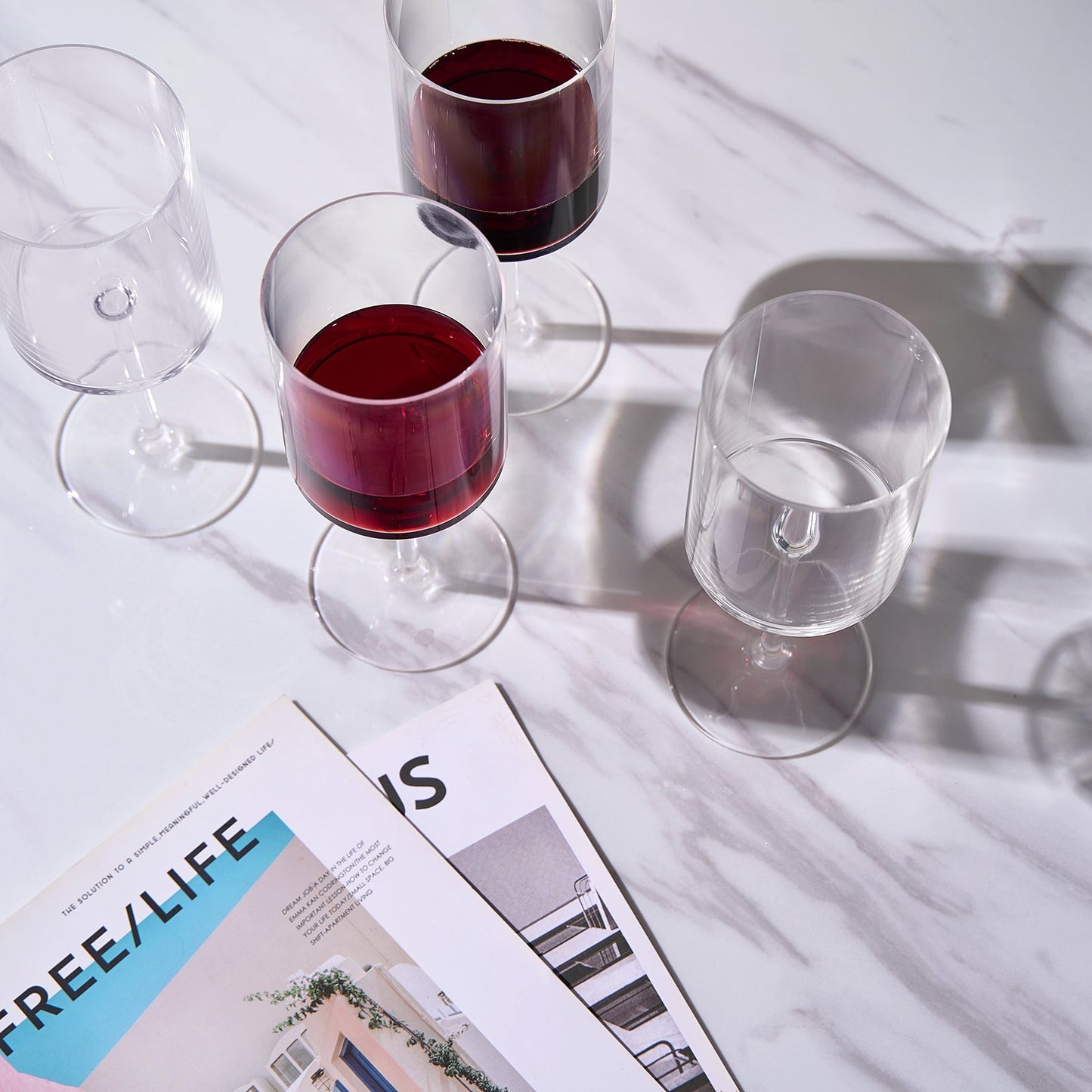 Acrylic stemmed wine glasses set of 8 with red wine in clear bowls