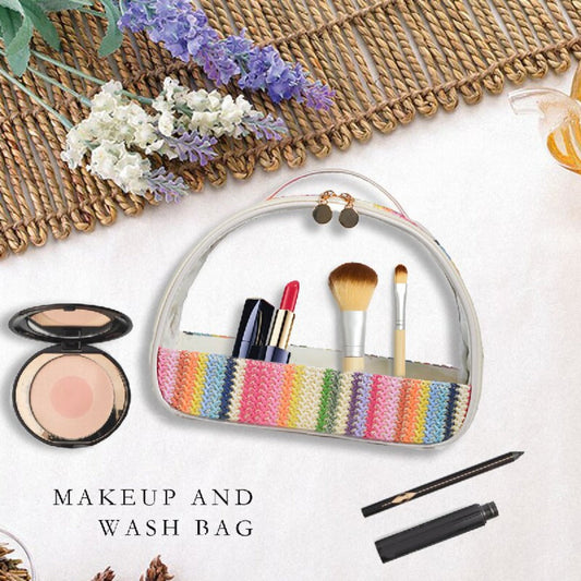 Rainbow striped clear makeup wash bag open, showing brushes and cosmetics inside