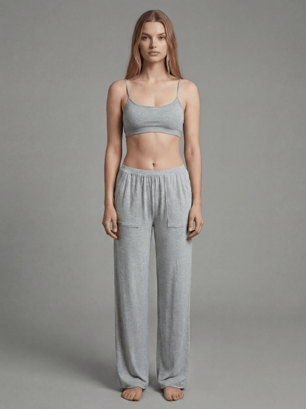 Heather gray pajama pants with elastic waist and side pockets, relaxed wide-leg fit.