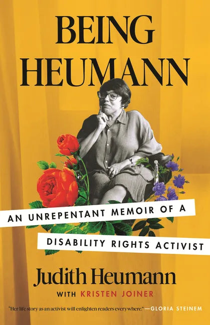 Paperback memoir book cover with portrait of Judith Heumann and colorful flowers.