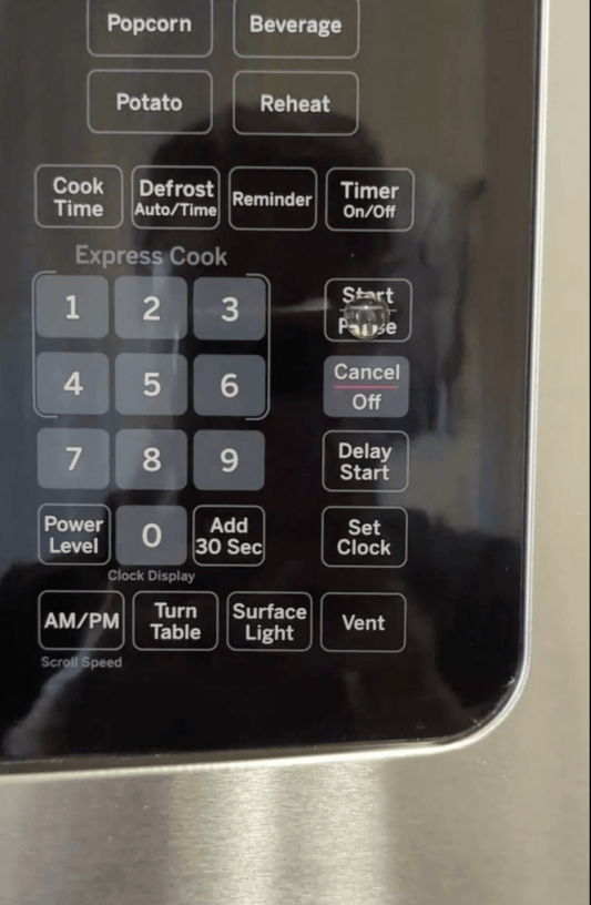 Microwave control keypad with start/pause, cancel, and number buttons