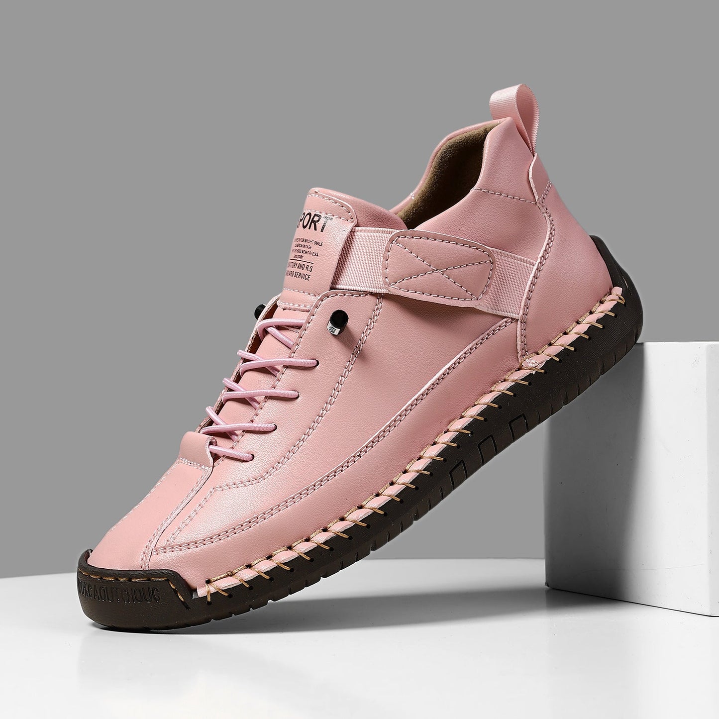 Pink casual leather lace-up boots with side strap, stitched seams, and platform sole