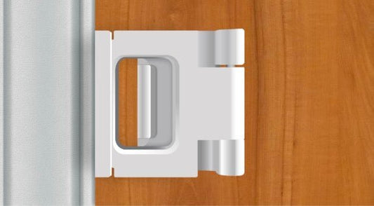 White door lock guard limiter shown in doorway with rectangular latch opening