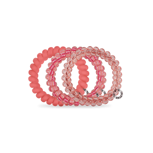 Stack of large pink hair ties with solid coral and pink check beads