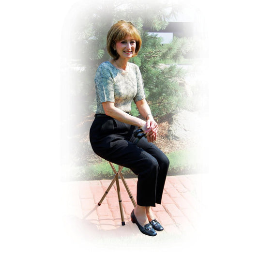 Tripod cane seat stool with round black cushion seat and four folding legs