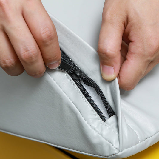 Gray soft foam climbing block with black zipper seam detail