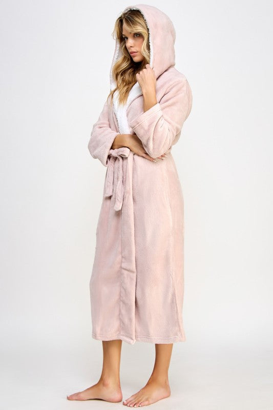 Pink hooded robe with plush collar, tied belt, long sleeves; side view