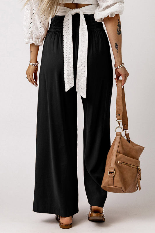 Black wide-leg pants with elastic waistband and long tied drawstring
