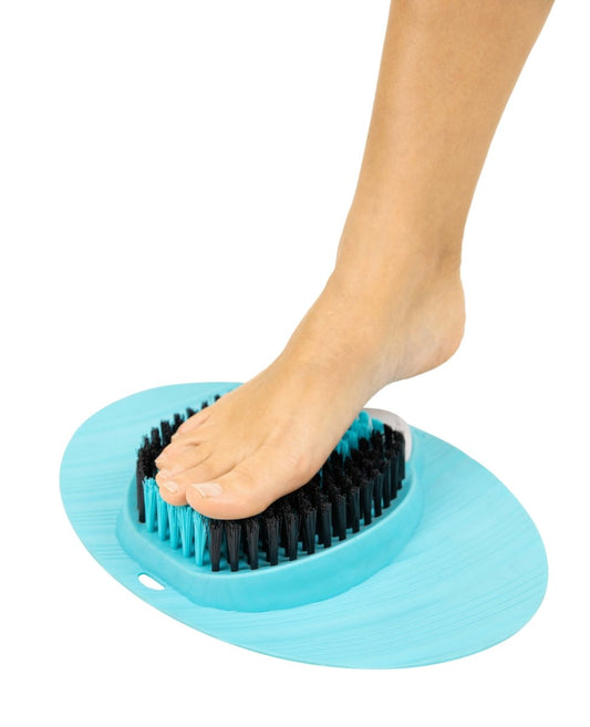 Foot scrubber on foot, blue base with black and teal bristles