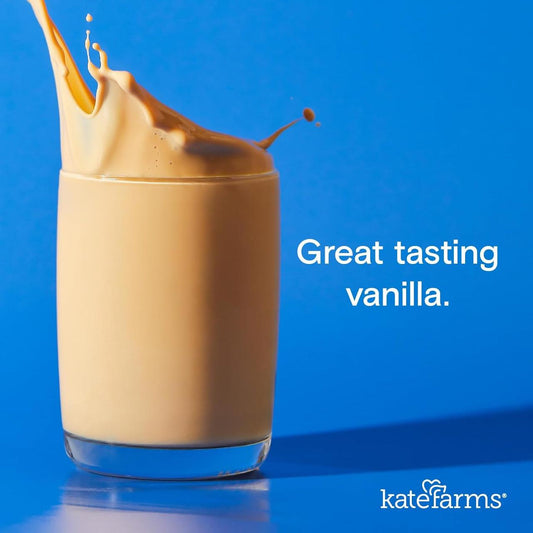 Vanilla nutrition shake in a glass, creamy light brown color