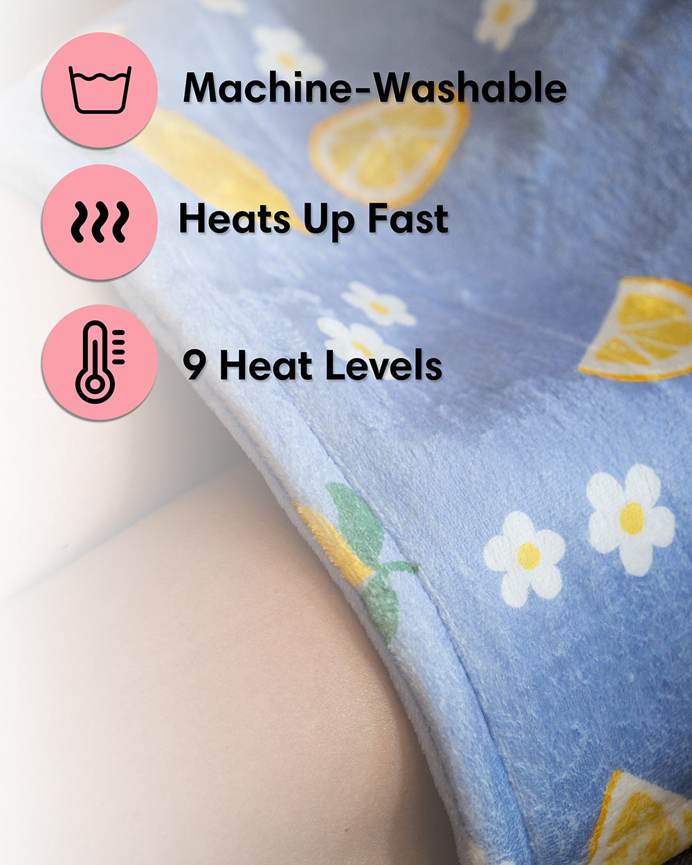 Blue plush heating pad close-up with lemon and flower print