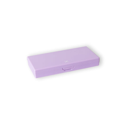 Lilac pill box with hinged lid closed, small clasp and star logo