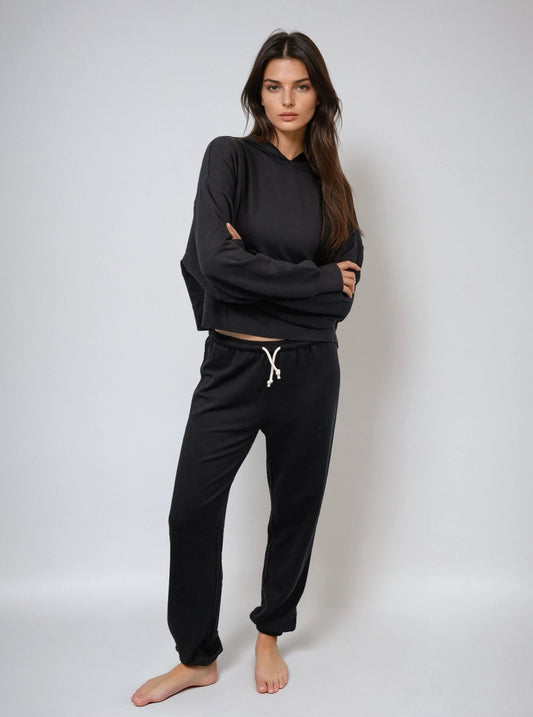 Black cropped hoodie, front view with hood and drawstring; relaxed long sleeves