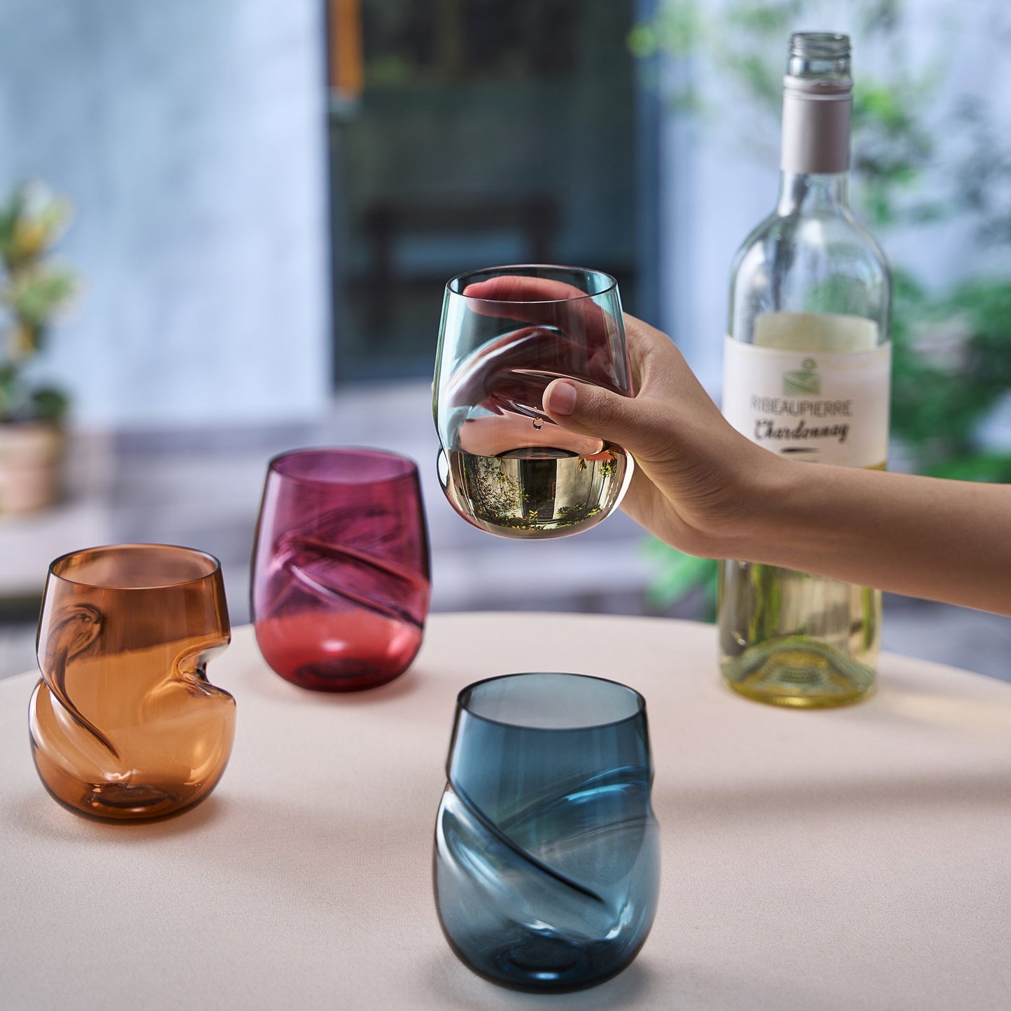 Acrylic stemless wine glasses set of 4 with finger indent; amber, pink, red, and blue