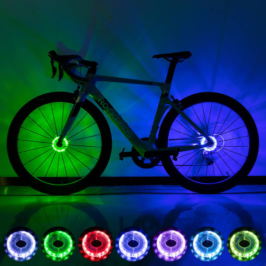 Multi-color LED bike wheel hub light rings glowing green and blue