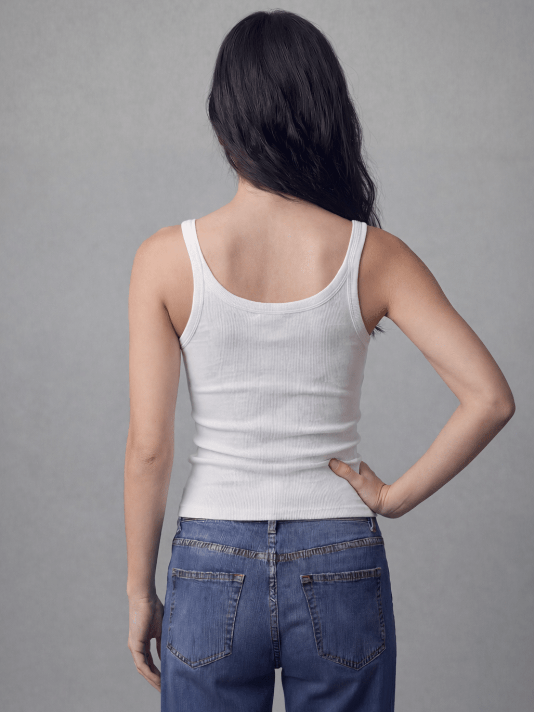 White spaghetti tank with thin straps and scoop back, fitted ribbed knit