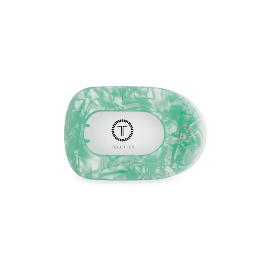 Mint green translucent round hair clip back with T logo and hinge pins