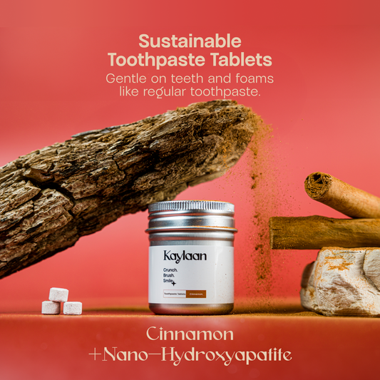 Kaylan toothpaste tablets container with cinnamon sticks and a few round tablets