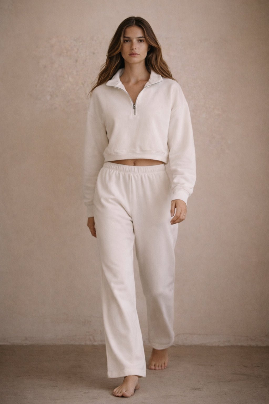 White straight-leg sweatpants with elastic waistband and cuffed ankle hem