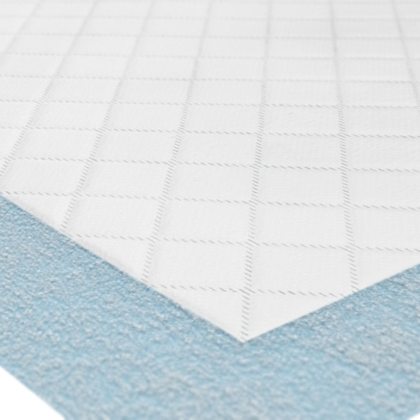 Absorbent underpad close-up: white quilted surface with blue underside border