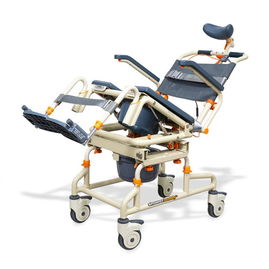 Tilt shower chair over bath with dark blue cushions, fold-up footrest, and mobile casters