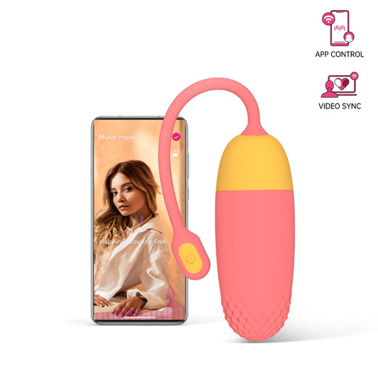 Pink and yellow silicone massager with loop handle and textured base