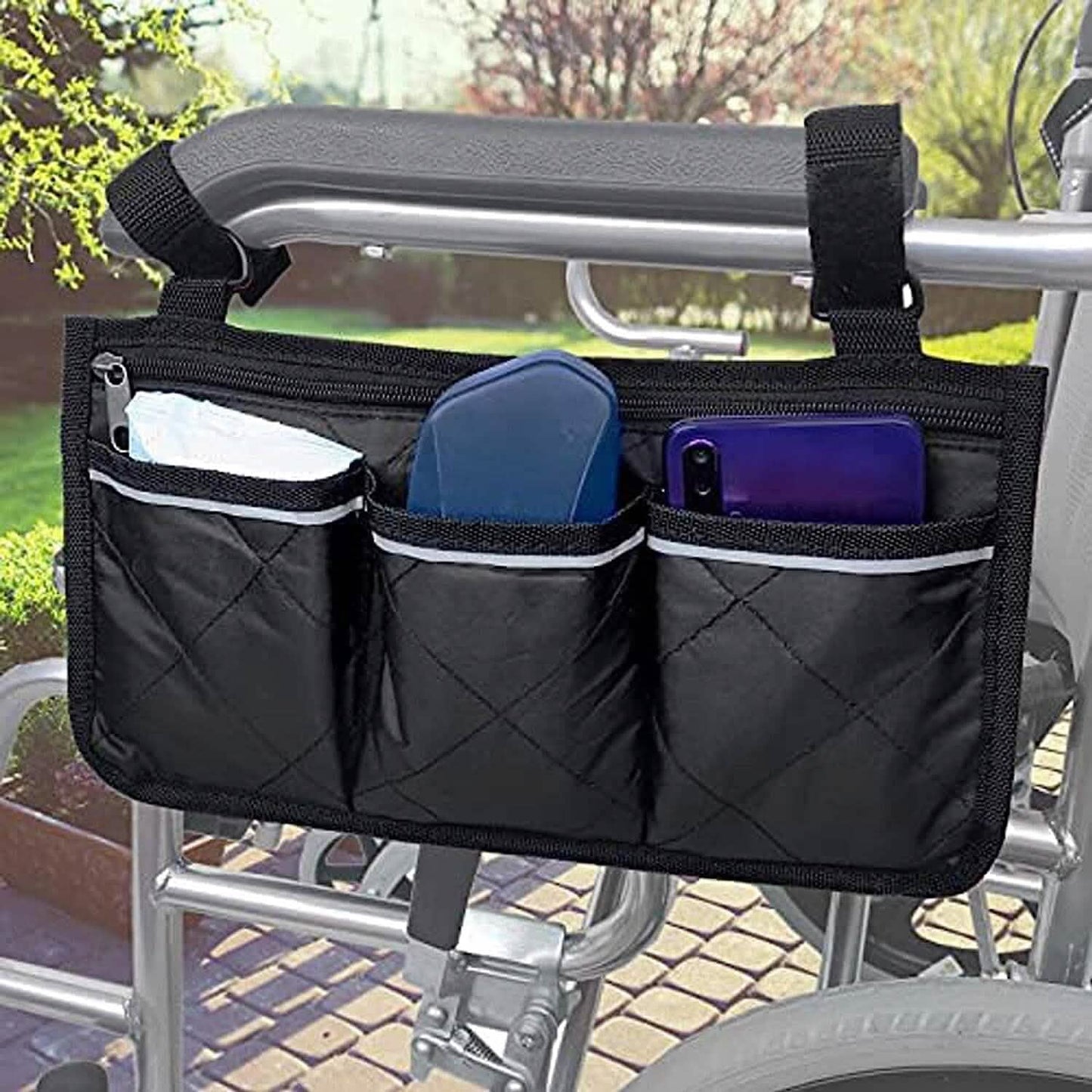 Black wheelchair armrest organizer bag with multiple side pockets and straps.