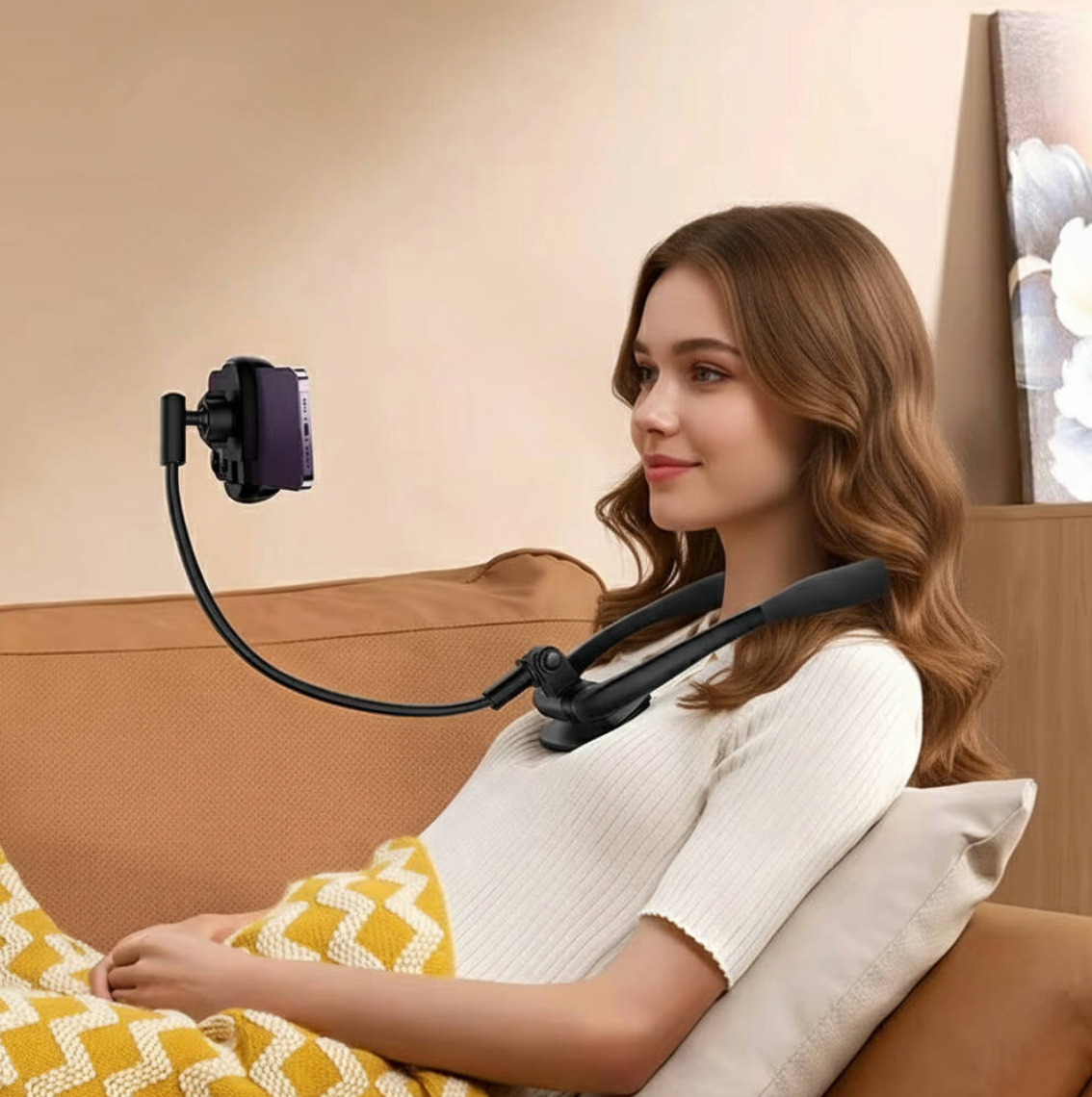 woman recling on a couch with a hands free phone holder around her neck, holding her phone in front of her face