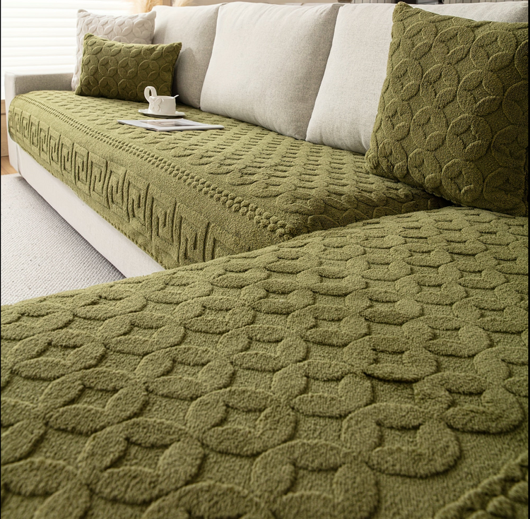 A green textured waterproof cover on a sofa
