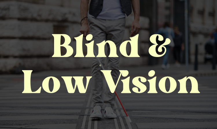 Words Blind & Low Vision on top of a man walking across the street with a white cane