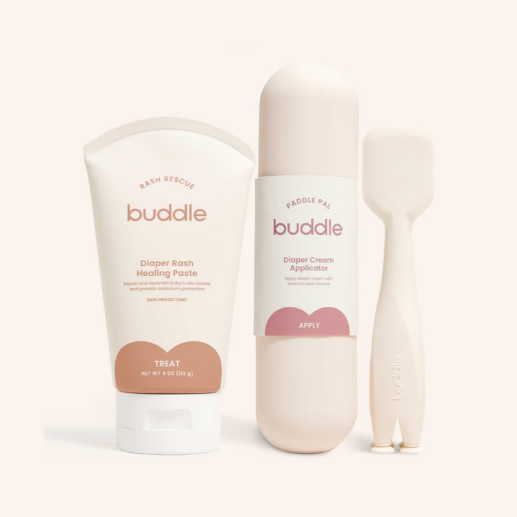 Buddle Balm cream and lotion bottles on cream background