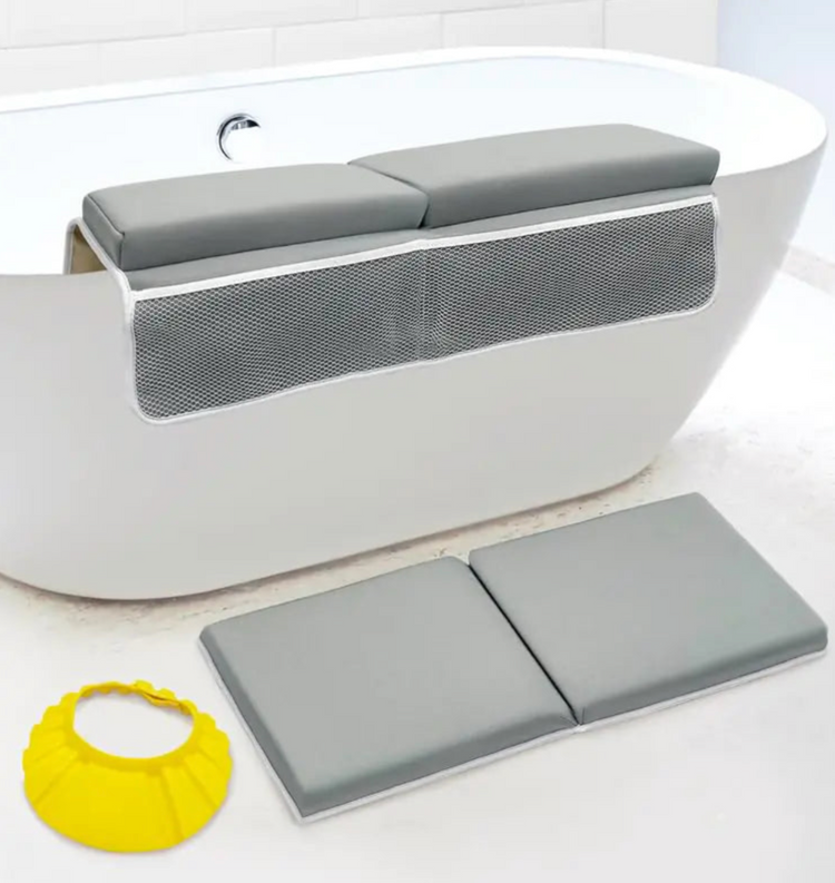 Gray bath seat with mesh back and gray bath mat on a white bathtub.