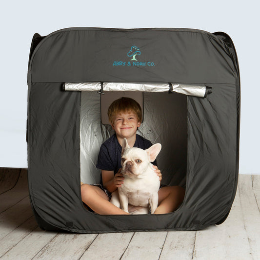 Black kids blackout tent with front window showing child holding a white dog
